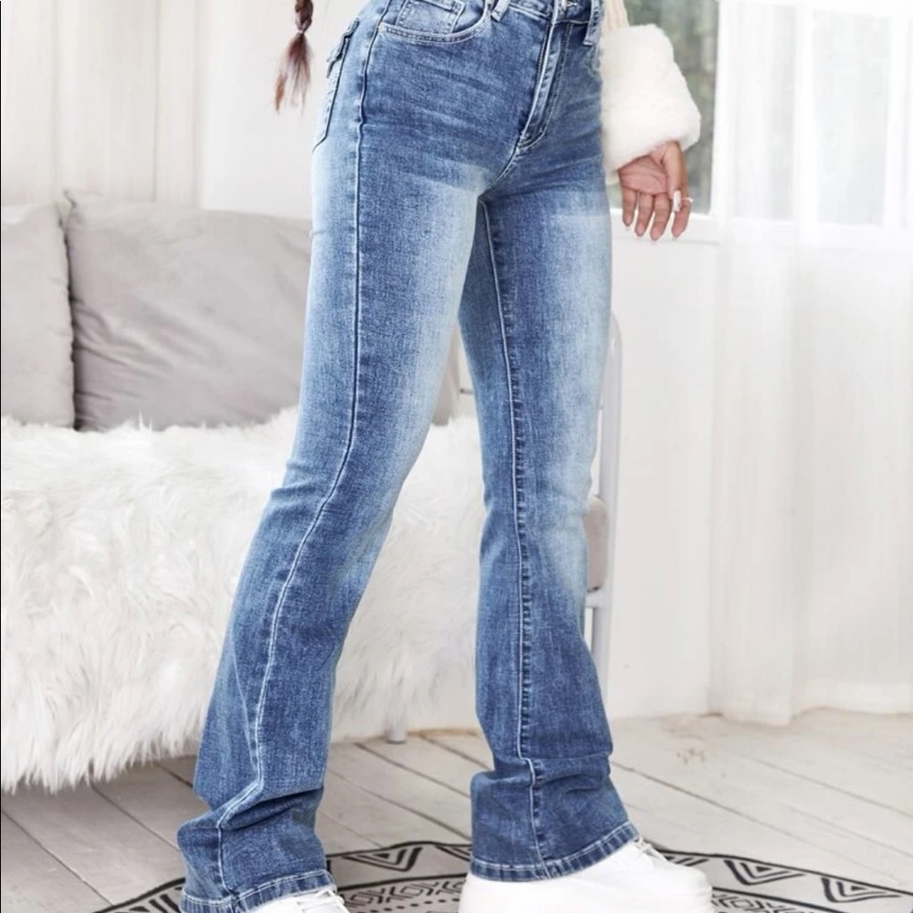 Light wash bell bottom jeans. SHEIN, size L. Never been worn.